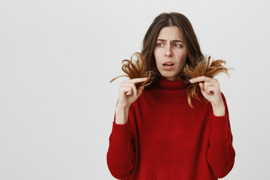 Woman concerned about hair fall and split ends
